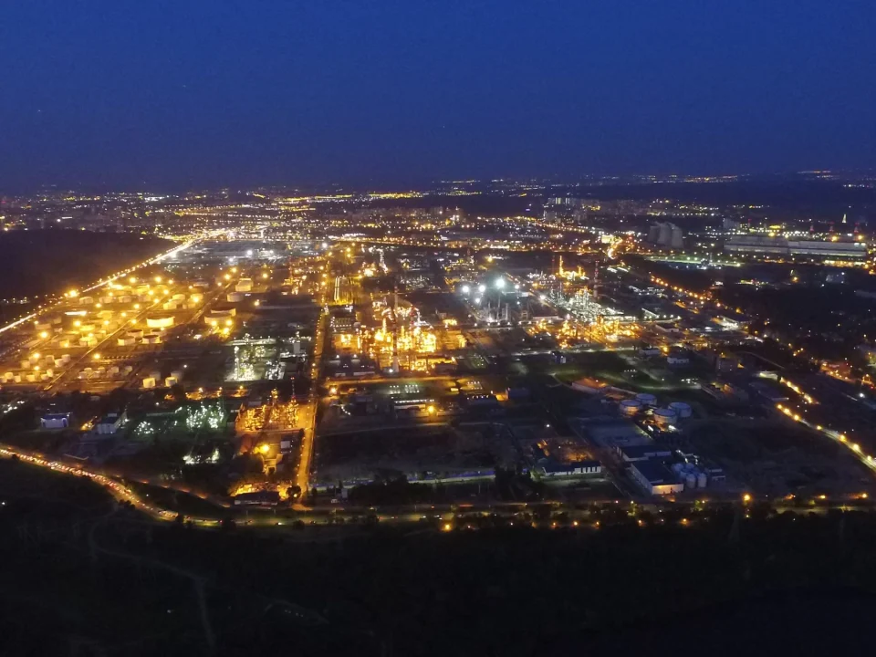 Aerial view of an oil refinery illuminated at night