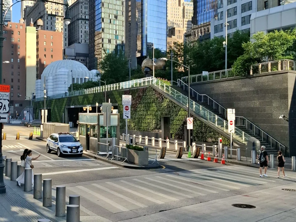 Vehicle security checkpoint with bollards and barriers